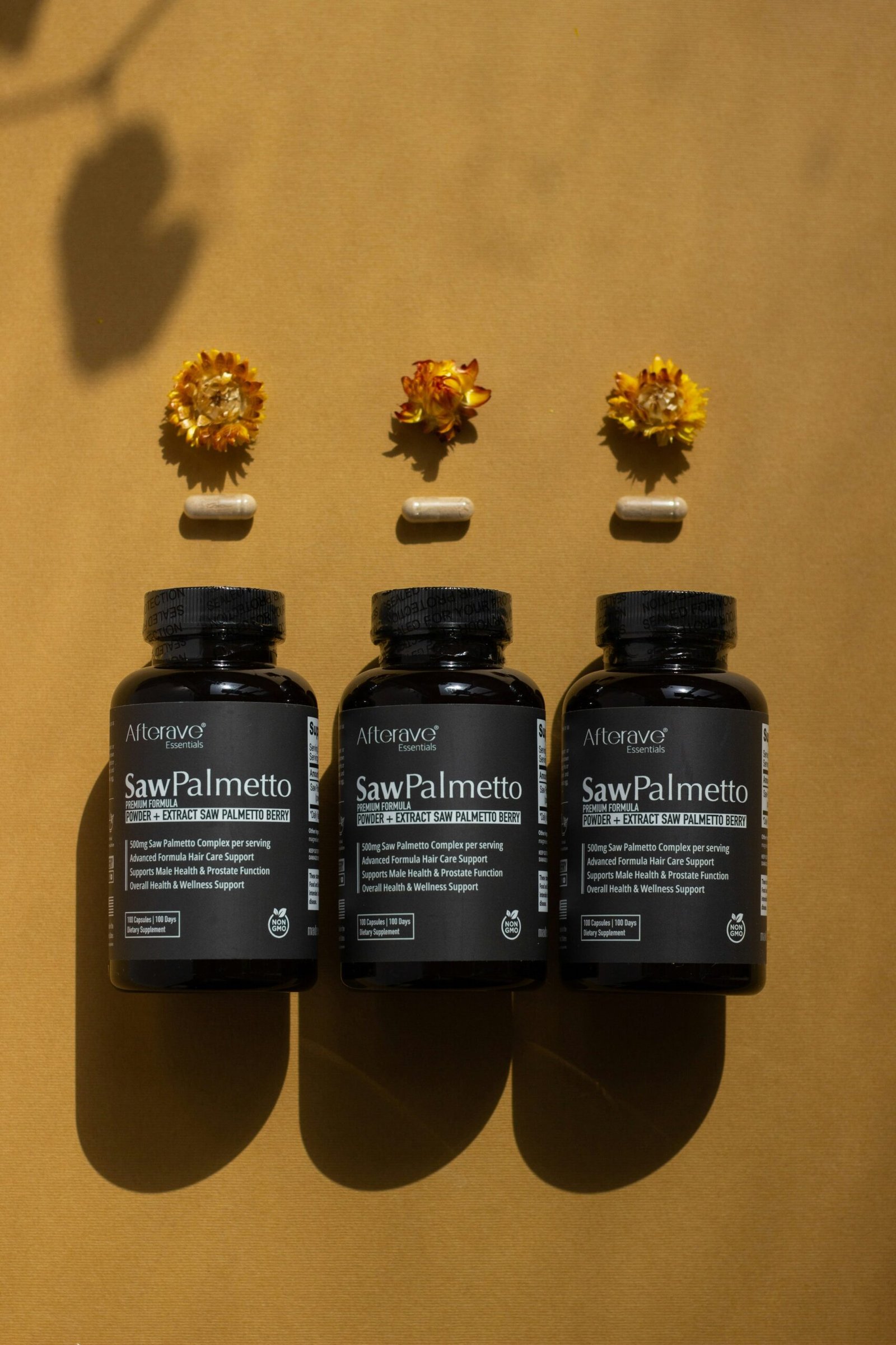 A group of three bottles of vitamins sitting on top of a table